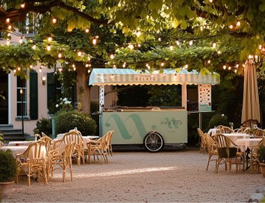 NUANCE gelato cart in a garden terrace under warm string lights